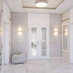 Elegancki korytarz z subtelnymi detalami - przyjemne powitanie w domu, zachęcające do odkrywania wnętrz pełnych stylu i harmonii